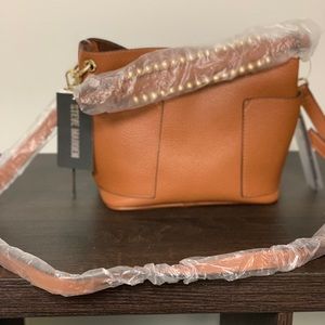 Steve Madden bucket purse 
Cognac
